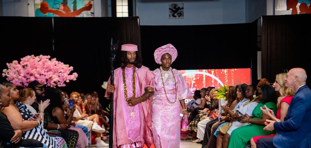 Adeyemi RoyaLabel models in pink heritage-inspired garments walking the runway at Heartland International Fashion Week Season Six